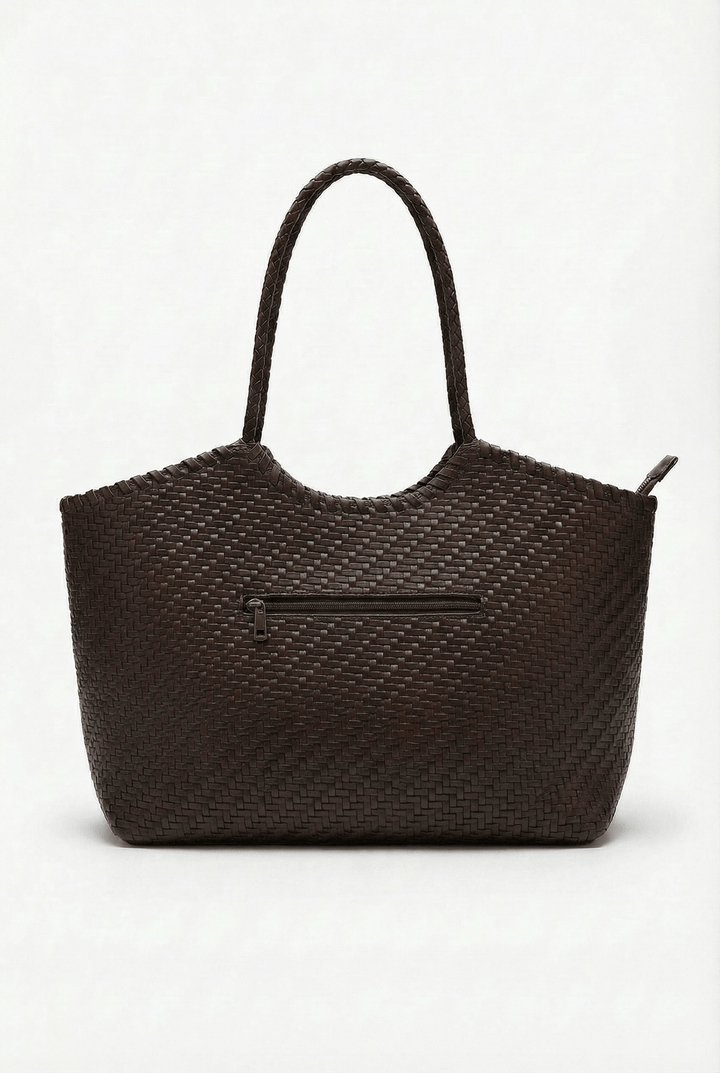 Karla woven shoulder bag by Emma & Rose Cape Town, featuring a stylish handcrafted design with a woven texture and shoulder strap.
