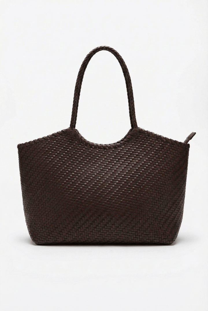 Karla woven shoulder bag by Emma & Rose Cape Town, featuring a stylish, natural woven design with shoulder strap and compact shape.