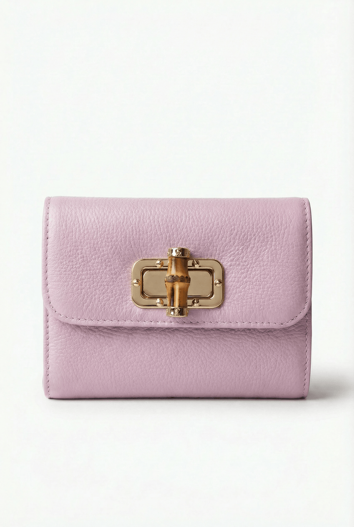 Elegant Emma & Rose Cape Town Heleen™ leather pouch with a stylish closure, showcasing its sleek design and high-quality leather.