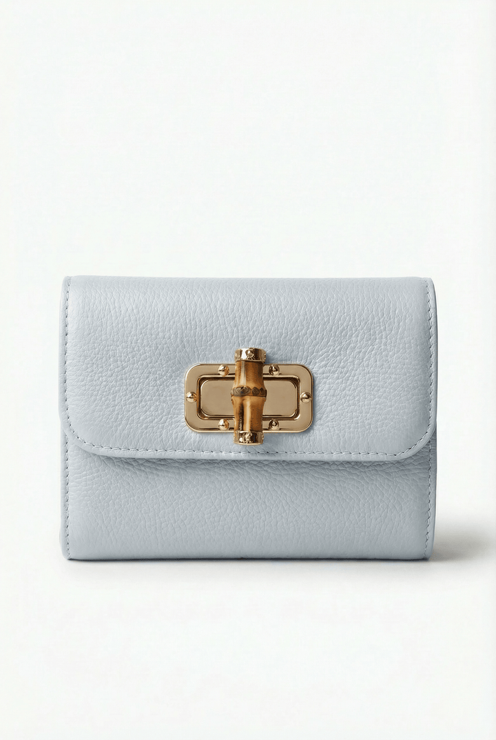 Heleen™ elegant leather pouch with stylish closure, crafted by Emma & Rose Cape Town, showcasing a sleek design in soft leather.