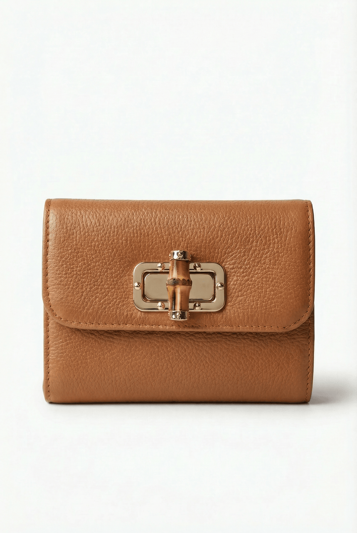 Heleen™ elegant leather pouch with stylish closure, crafted by Emma & Rose Cape Town, showcasing smooth leather and refined design.