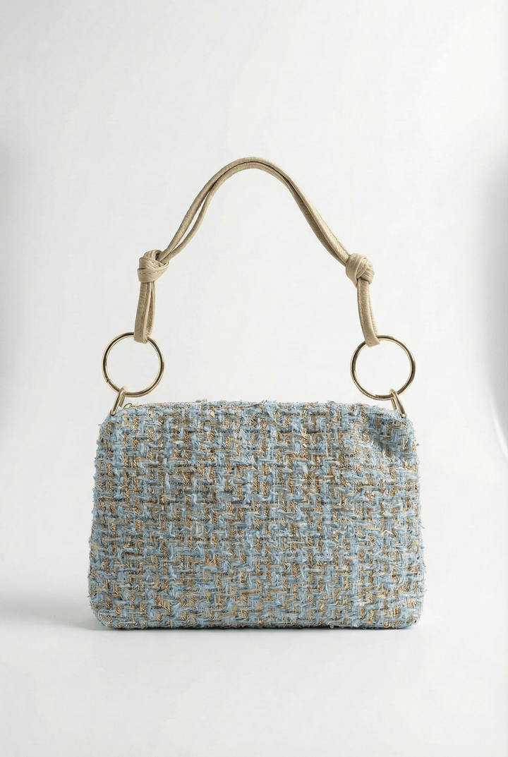 Jacoba™ Emma & Rose Cape Town bouclé fabric handbag with structured design and leather accents, shown in a close-up view.