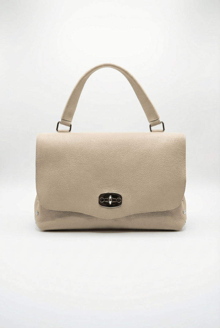 Gretchen Emma & Rose Cape Town genuine leather handheld bag with closure, showcasing sleek design and high-quality craftsmanship.