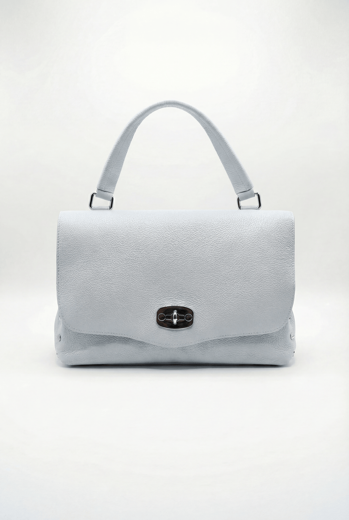 Emma & Rose Cape Town Gretchen genuine leather handheld bag with closure, featuring a sleek, structured design and top handle.
