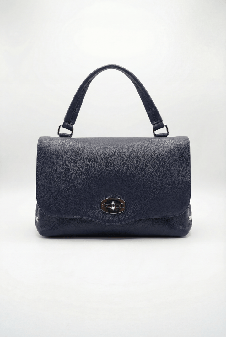 Gretchen™ Emma & Rose Cape Town genuine leather handheld borsa with closure, featuring a sleek design and elegant craftsmanship.