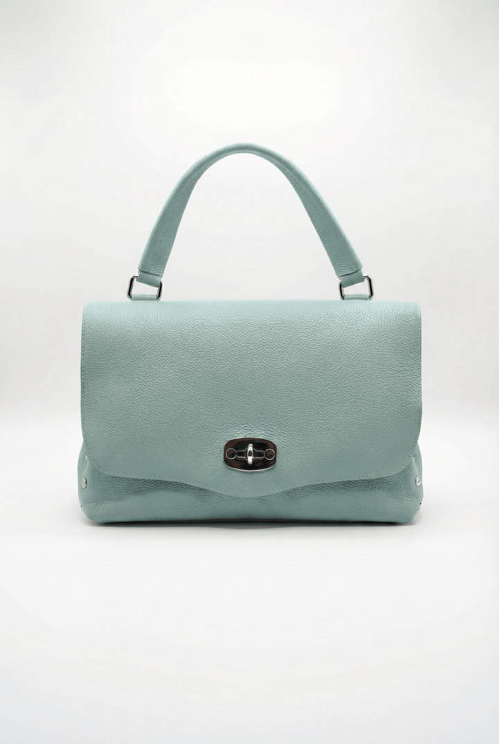 Gretchen Emma & Rose Cape Town genuine leather handheld bag with a sleek closure and elegant design.