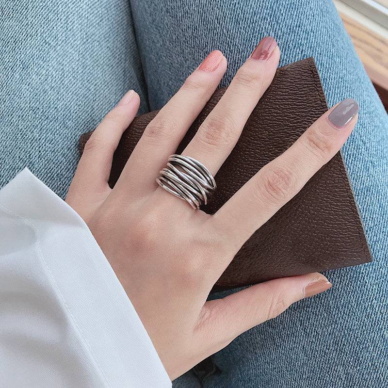 Elegant silver ring by Emma & Rose Cape Town featuring a sleek Lagered design, displayed on a neutral background.