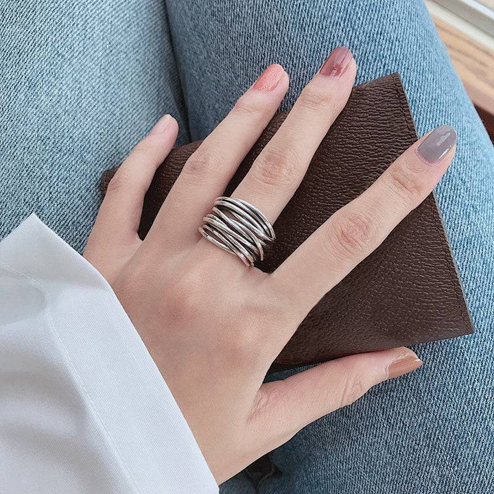 Elegant silver ring by Emma & Rose Cape Town featuring a sleek Lagered design, displayed on a neutral background.