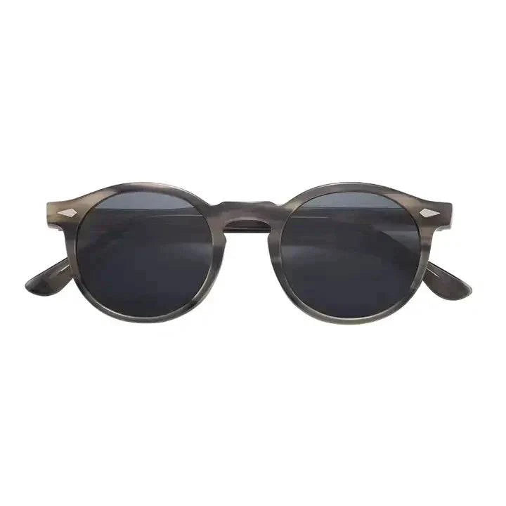 Skyler™ tinted sunglasses by Emma & Rose Manhattan with round frames and shaded lenses, stylish and perfect for sunny days.