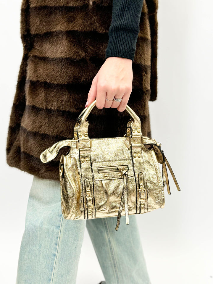 Emma & Rose Cape Town Lize™ genuine leather handbag with gold accents, showing the stylish shoulder strap and textured leather surface.