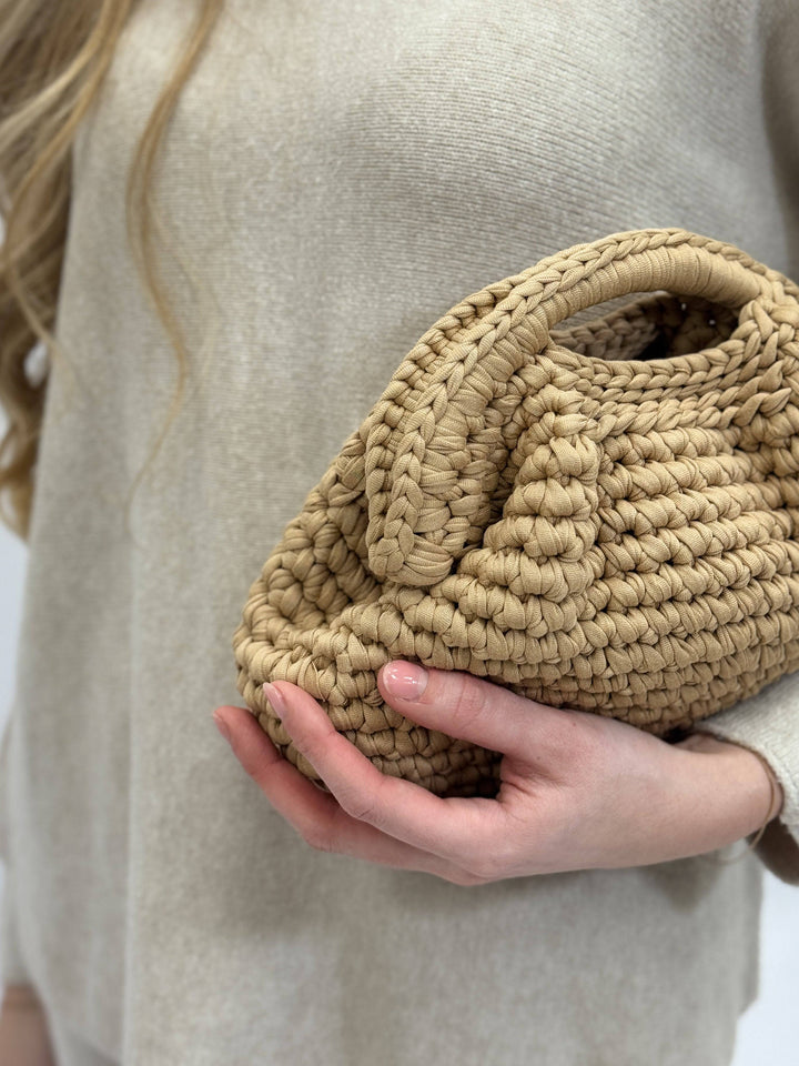Emma & Rose Cape Town Ingrid™ crochet bag with intricate woven design, artisan craftsmanship, and natural fiber texture.