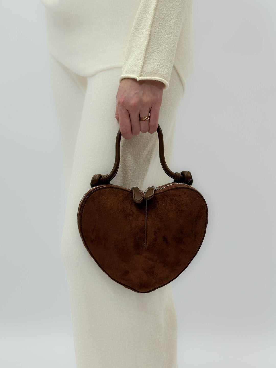 Greta™ heart-shaped suede effect chic borsa by Emma & Rose Cape Town, shown in a stylish heart-shaped design with textured suede finish.
