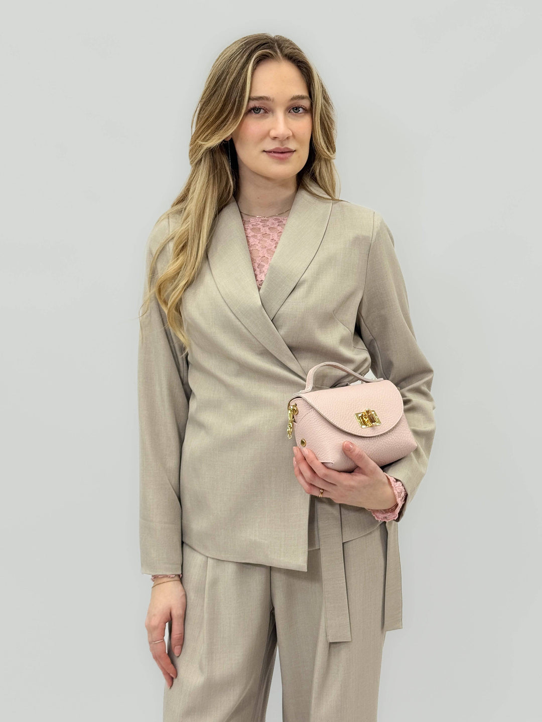 Anneke™ crossed blazer, belt, and trousers set by Emma & Rose Cape Town, featuring a stylish coordinated suit look.