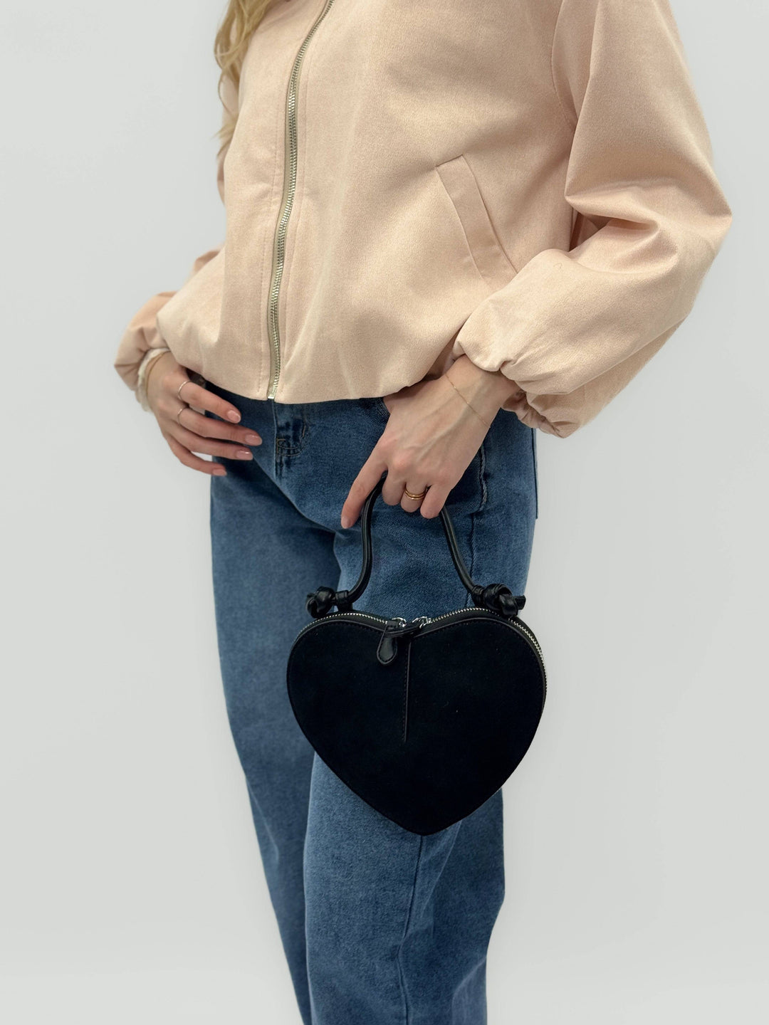 Emma & Rose Cape Town Greta™ heart-shaped suede-effect chic bag with gold accents and adjustable strap.