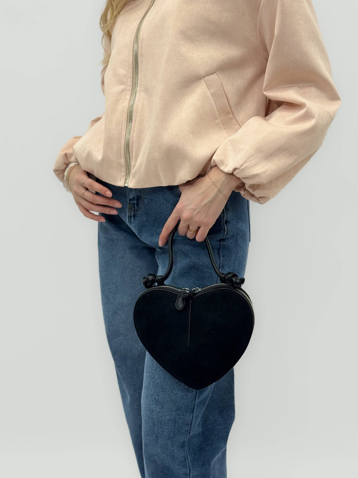 Emma & Rose Cape Town Greta™ heart-shaped suede-effect chic bag with gold accents and adjustable strap.