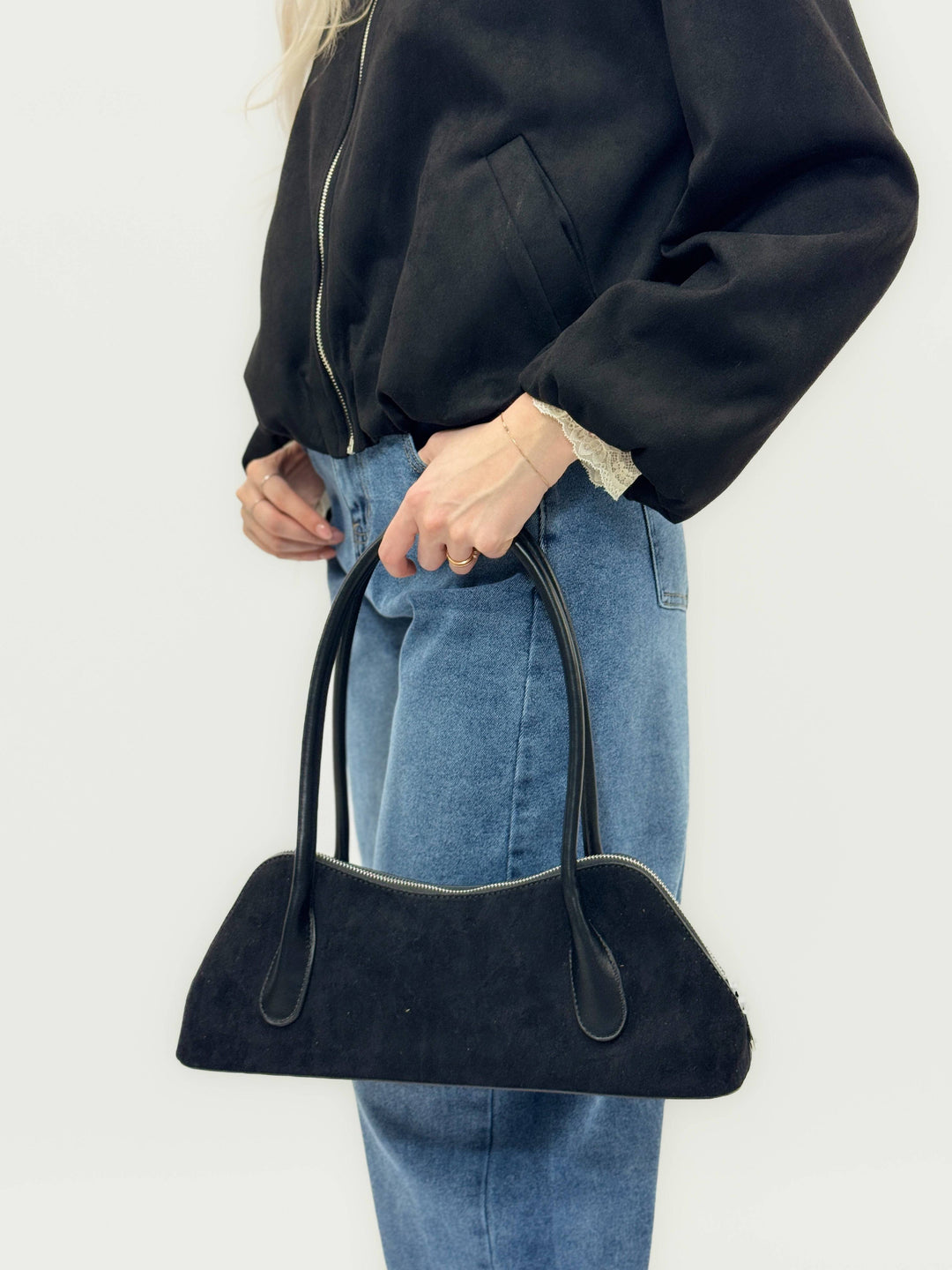 Carien™ women's faux leather bag by Emma & Rose Cape Town, shown in a stylish model with sleek design and detailed stitching.