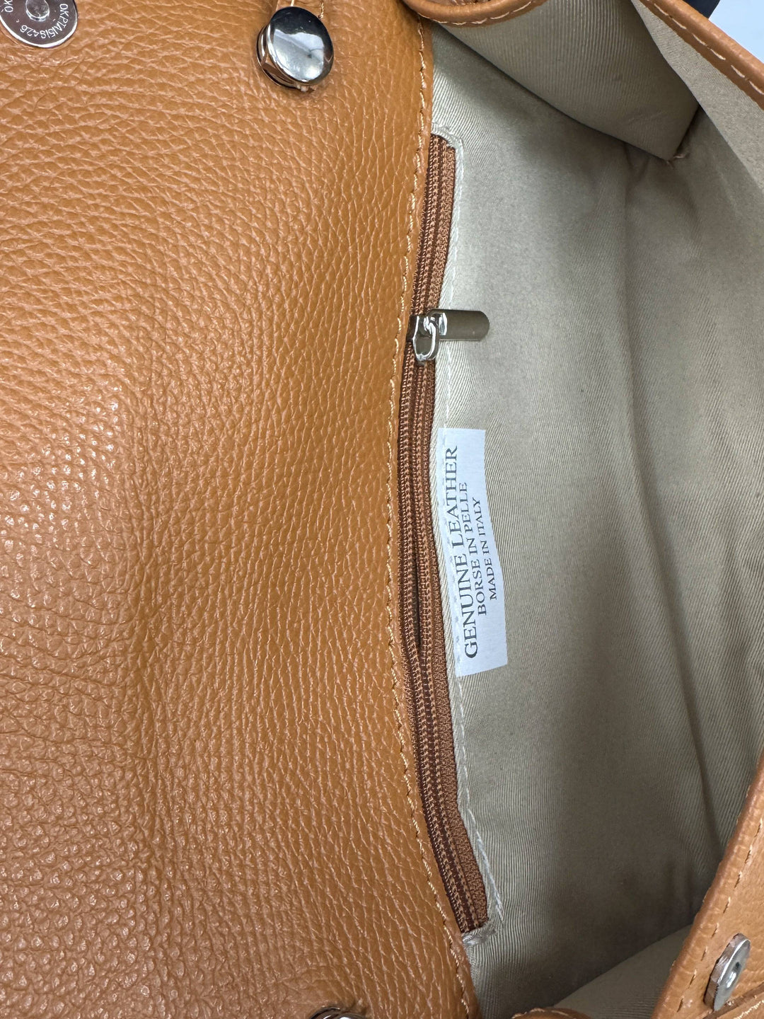 Anke™ Emma & Rose Cape Town genuine leather bag with elegant design, showcasing smooth leather and stylish handles.