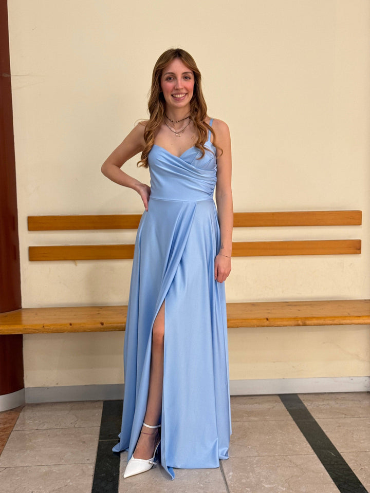 Elegant long dress with a stylish neckline from Emma & Rose Cape Town, featuring flowing fabric and sophisticated design.