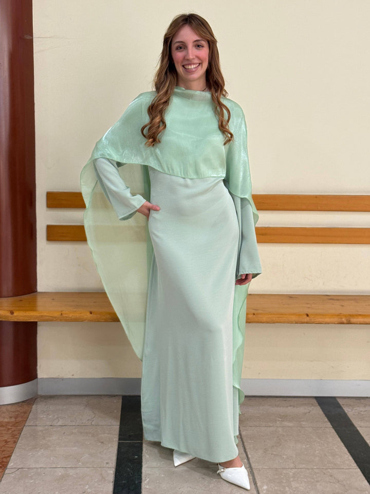 Elegant Mieke™ long dress cape from Emma & Rose Cape Town featuring flowing fabric and intricate detailing.