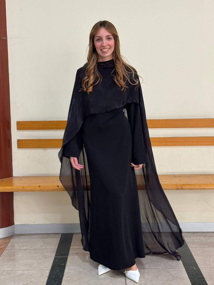 Elegant long dress cape by Emma & Rose Cape Town, featuring flowing fabric and intricate design in a sophisticated style.