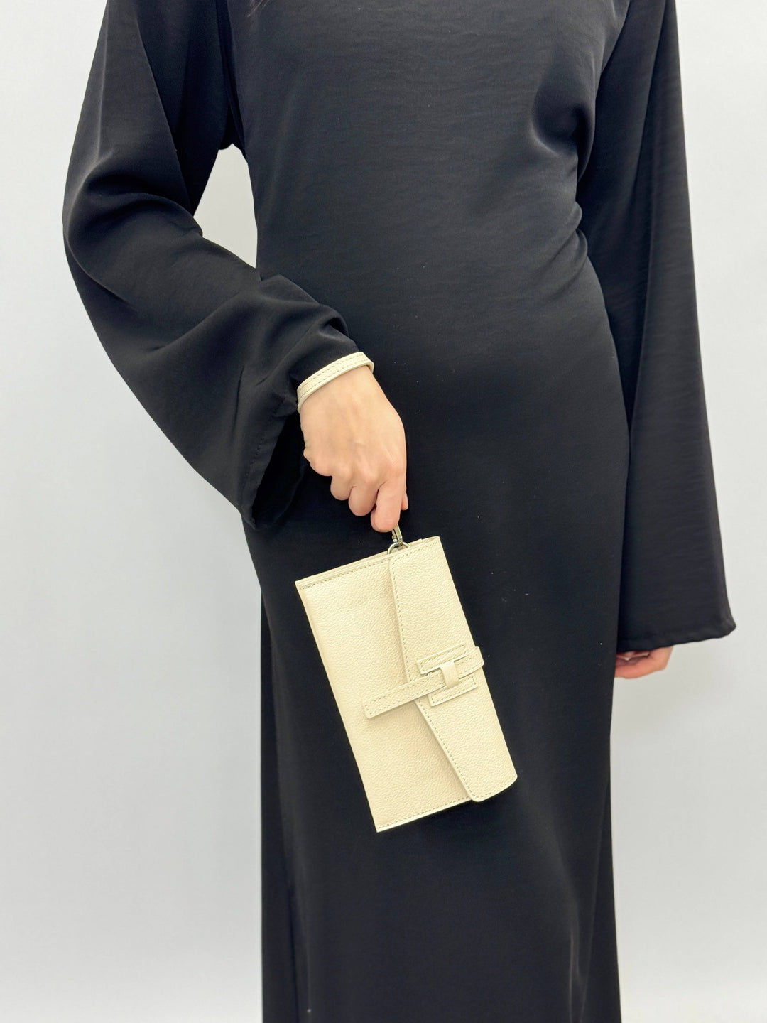 Leather clutch bag strap by Emma & Rose Cape Town, Yael™, showcasing its elegant design and high-quality leather material.