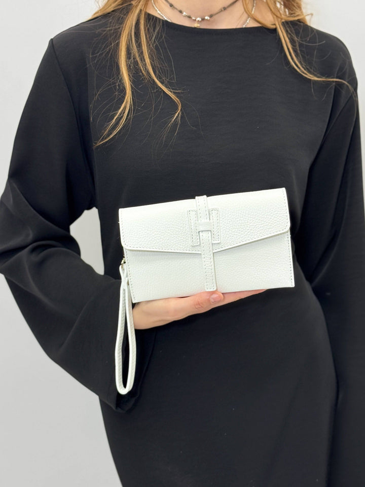 Emma & Rose Cape Town Yael leather clutch bag strap, stylish brown leather accessory with stitching details.