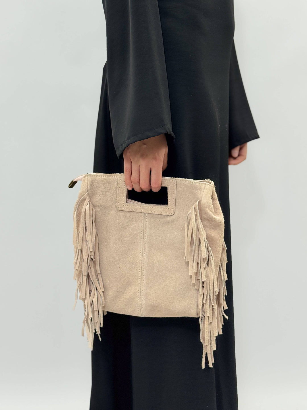 Emma & Rose Cape Town Elke™ suede leather bag with sleek design and elegant craftsmanship, showcasing its stylish exterior.