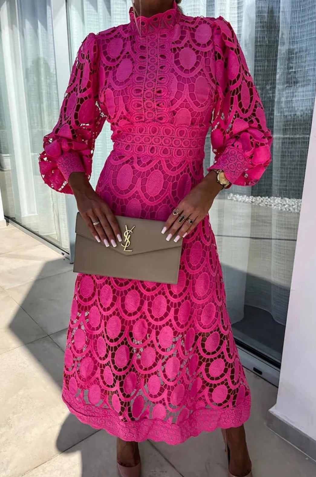 Elegant lace dress with high collar and transparent details
