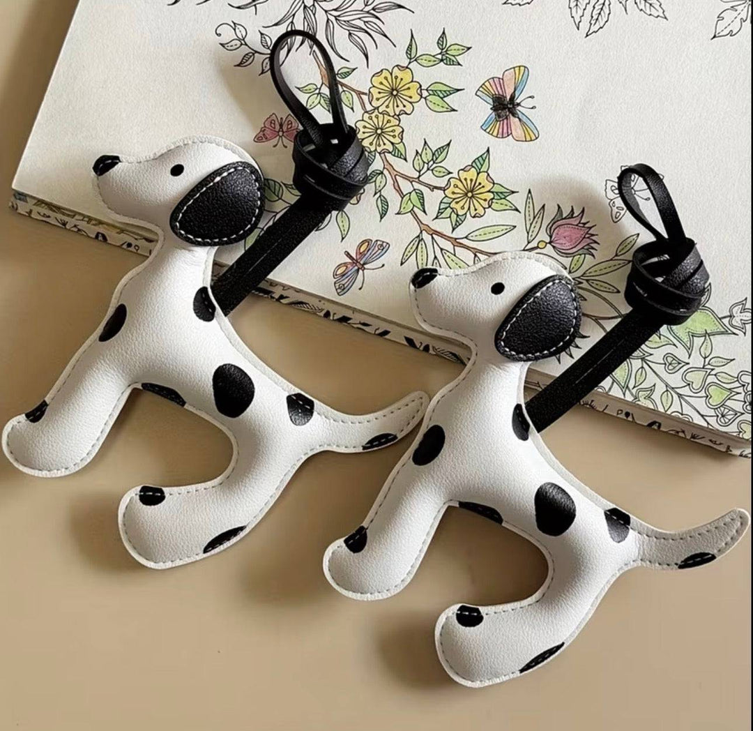 Dalmatian-shaped bag charm from the Vanessa™ collection by Emma & Rose Cape Town, featuring a playful black and white spotted design.