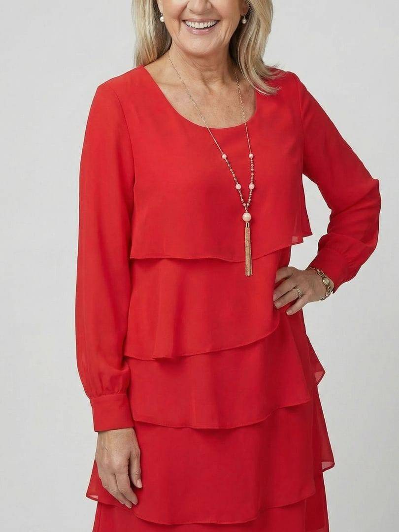 Layered knee-length dress by Emma & Rose Cape Town featuring a stylish design with flowing fabric and a flattering fit.