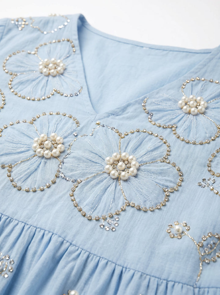 Close-up of the Lena floral midi dress by Emma & Rose Cape Town, showcasing the intricate floral pattern and elegant fabric.