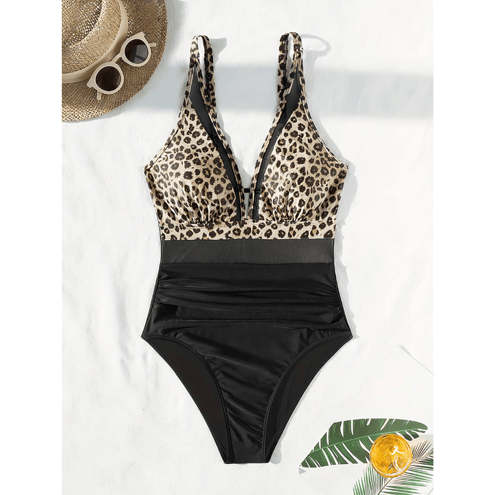 Emma & Rose Manhattan Johanna Crystal Cove Swimsuit shown in the image, featuring a stylish one-piece design with vibrant patterns.