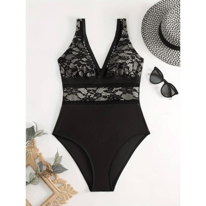 Midnight™ Glamour Swimsuit by Emma & Rose Manhattan, featuring a sleek black design and stylish cut for beach or pool.