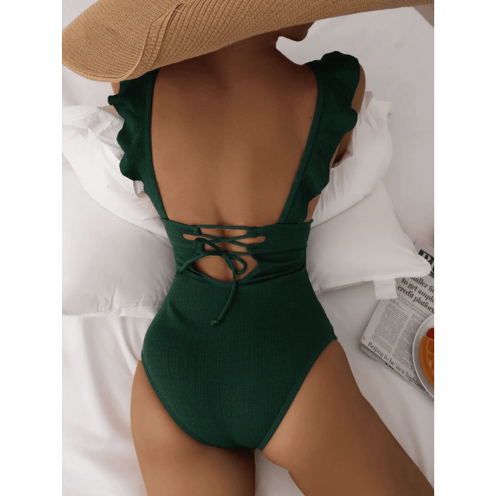Olivia™ Mirage Swimsuit by Emma & Rose Manhattan, featuring a stylish one-piece design with vibrant pattern and flattering fit.