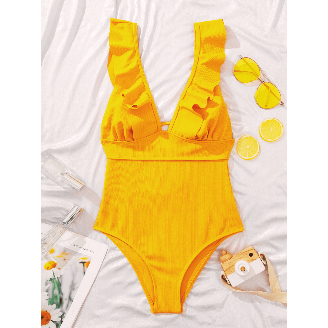 Olivia™ Mirage swimsuit by Emma & Rose Manhattan featuring a stylish, patterned one-piece design with a plunging neckline.