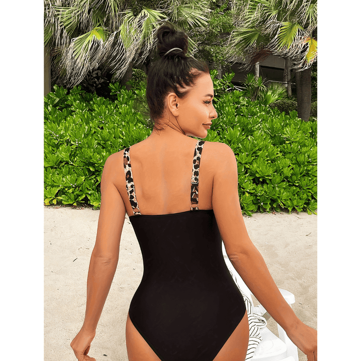 Margot™ Wild Swimsuit by Emma & Rose Manhattan featuring a vibrant, patterned swimwear design on a model.