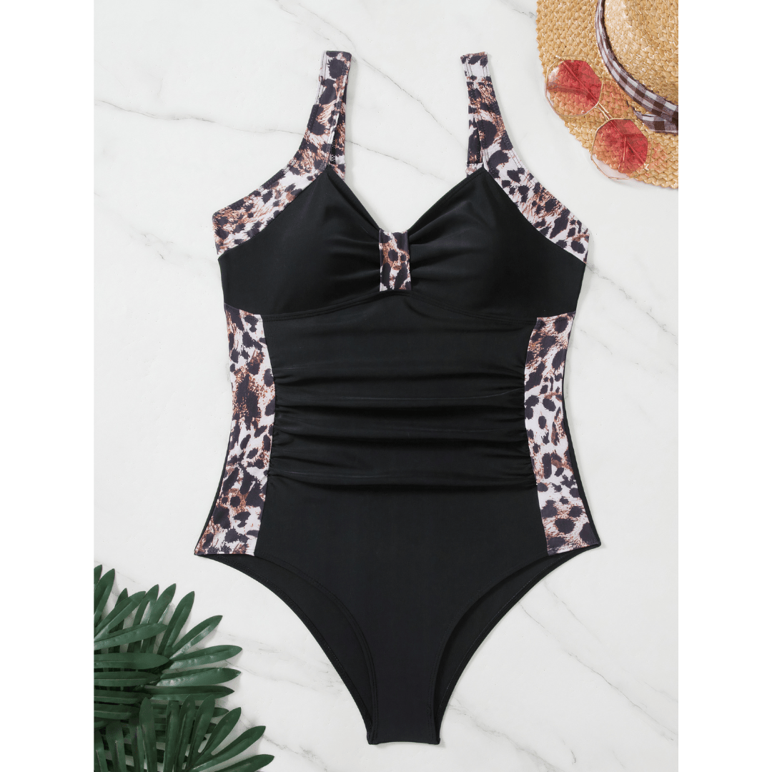 Emma & Rose Manhattan Margot™ Wild swimsuit featuring vibrant floral pattern and adjustable straps on a model.