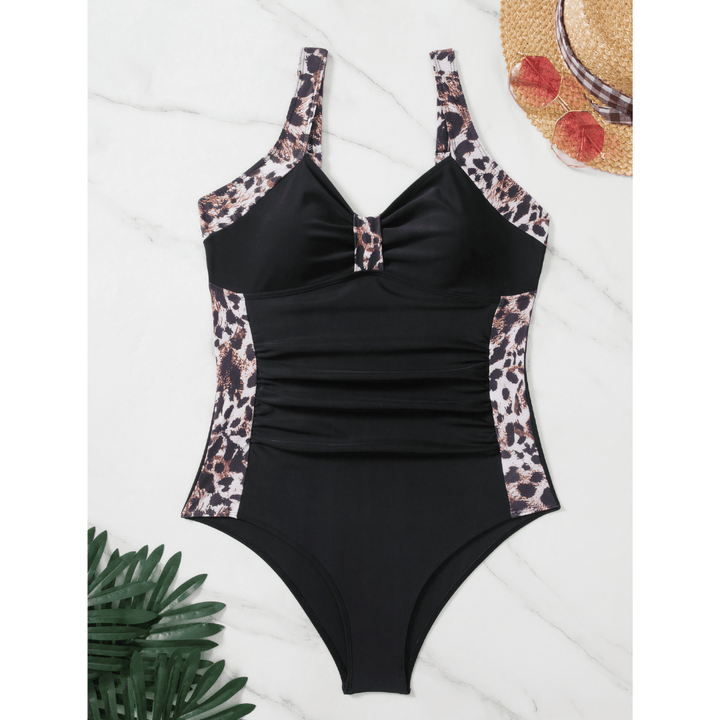 Emma & Rose Manhattan Margot™ Wild swimsuit featuring vibrant floral pattern and adjustable straps on a model.
