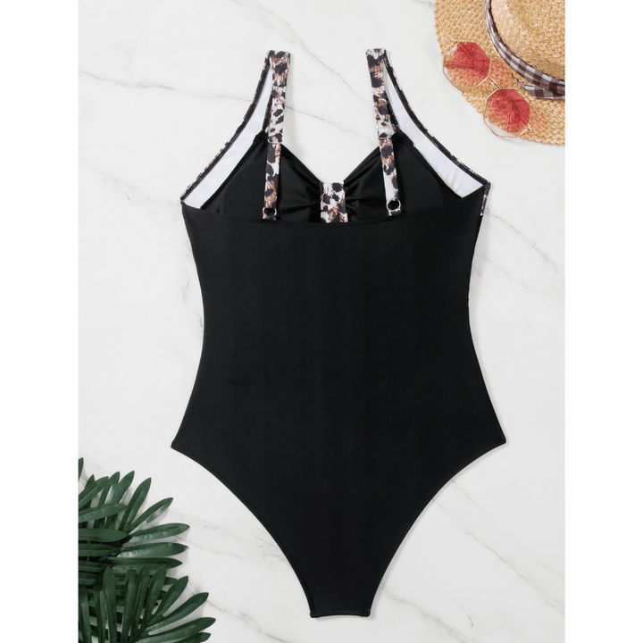 Emma & Rose Manhattan Margot Wild Swimsuit featuring a vibrant, patterned design and adjustable straps on a mannequin.