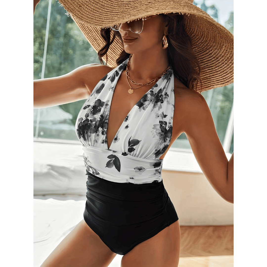 Marble™ Mirage swimsuit by Emma & Rose Manhattan displayed on a hanger featuring a stylish, patterned one-piece design.