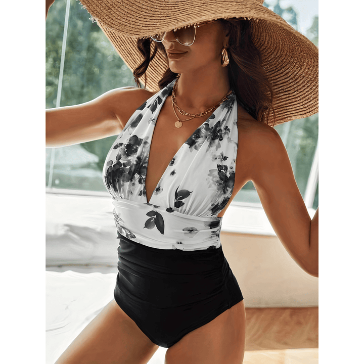 Marble™ Mirage swimsuit by Emma & Rose Manhattan displayed on a hanger featuring a stylish, patterned one-piece design.