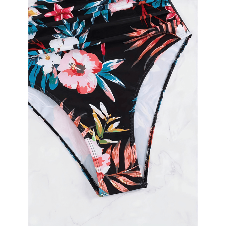 Lize™ Blossom Royale swimsuit by Emma & Rose Manhattan featuring floral print, vibrant colors, and a stylish one-piece design.