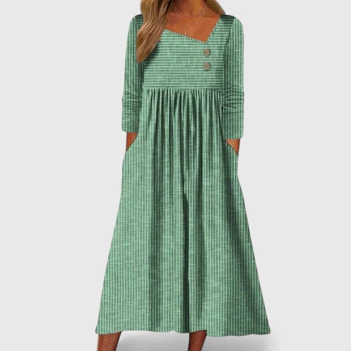 Elegant Cleomarie™ midi dress by Emma & Rose Cape Town featuring a flowing silhouette and intricate detailing.