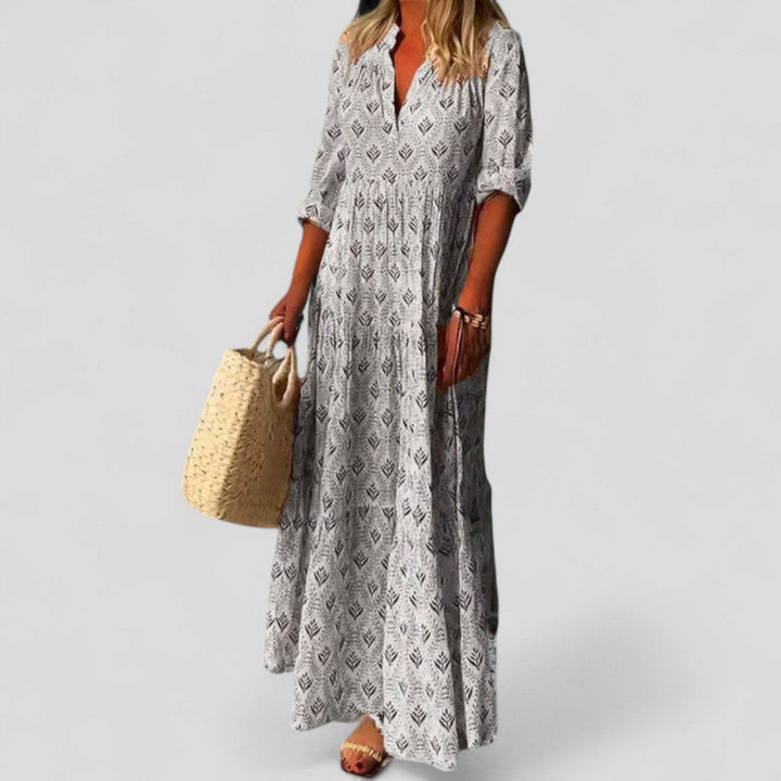 Emma & Rose Cape Town Marcivine™ sophisticated maxi dress in flowing fabric, featuring elegant design and a flattering silhouette.