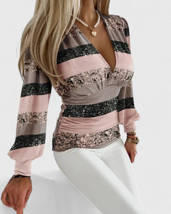Loravine™ elegant V-neck top by Emma & Rose Cape Town, featuring a stylish design in soft fabric, displayed on a hanger.
