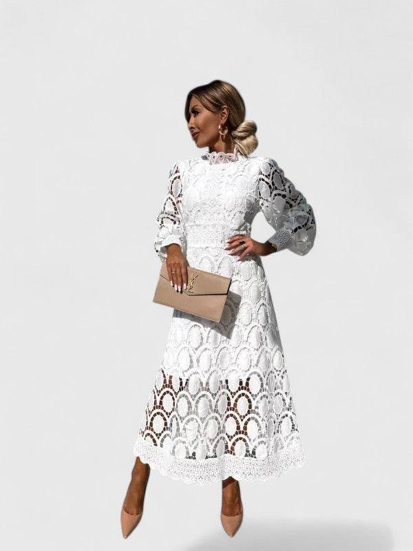 Kryzandra™ elegant dress by Emma & Rose Cape Town featuring a flowing fabric and stylish design on a mannequin.