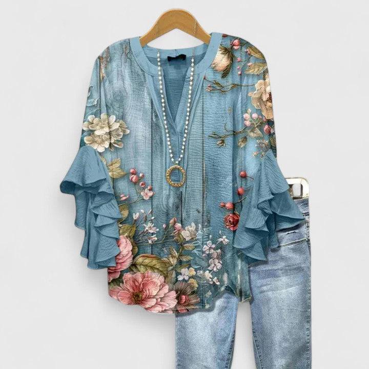 Saryphiah™ comfortable blouse by Emma & Rose Cape Town, featuring a relaxed fit and stylish design, displayed on a hanger.