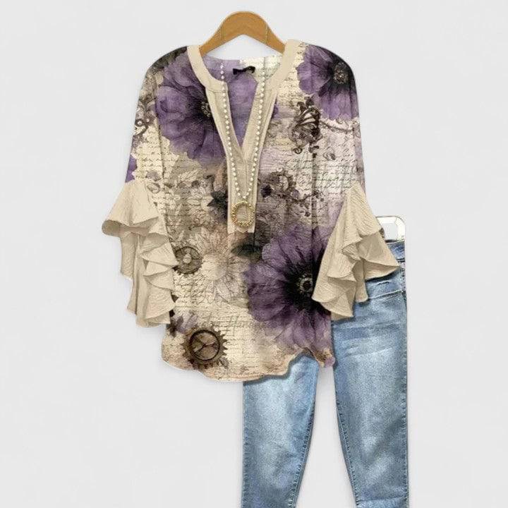 Emma & Rose Cape Town Saryphiah™ comfortable blouse with soft fabric and relaxed fit, displayed on a hanger with a plain background.