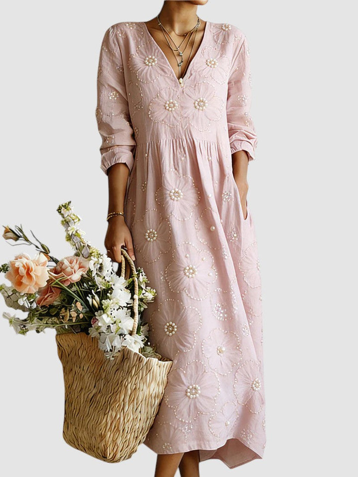 Floral midi dress by Emma & Rose Cape Town featuring a flowy silhouette and vibrant floral print, perfect for spring and summer.