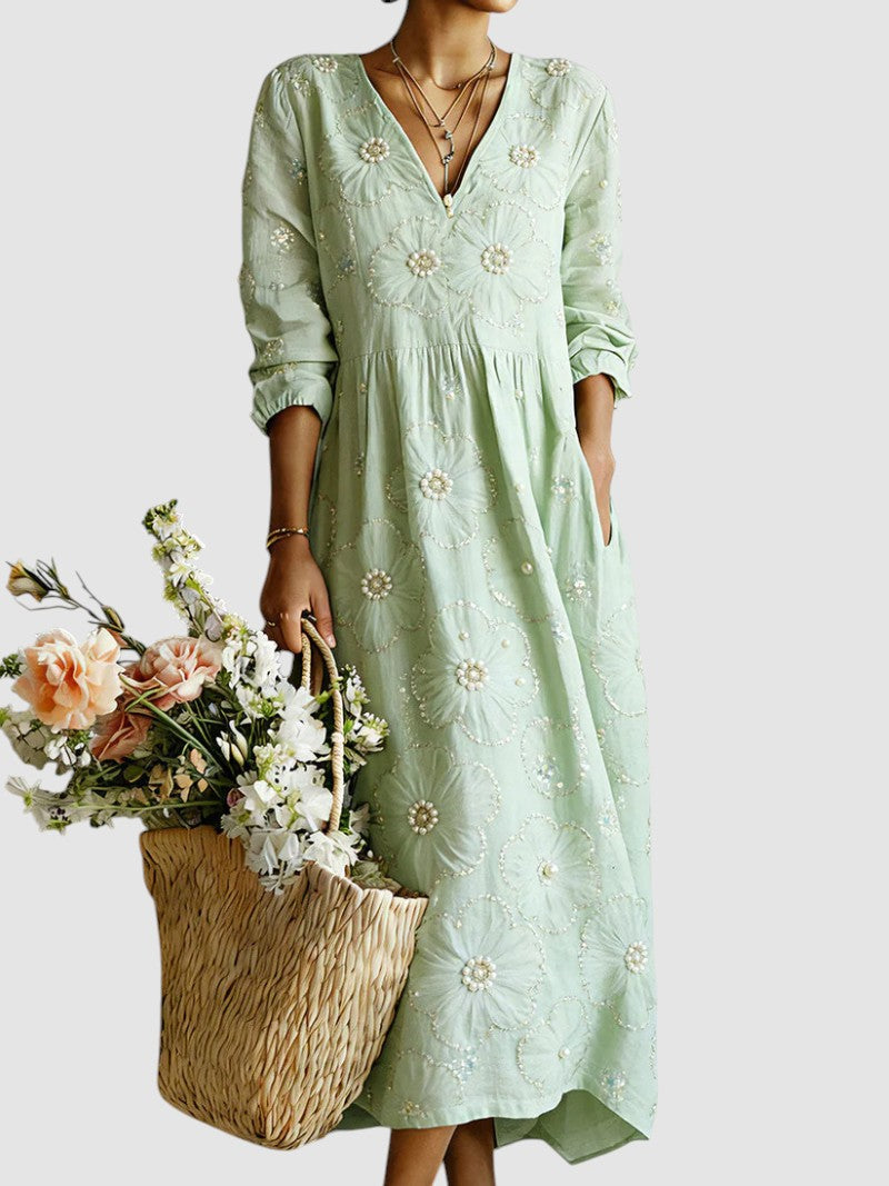 Floral midi dress by Emma & Rose Cape Town featuring a feminine design with colorful flower patterns and a flowing silhouette.